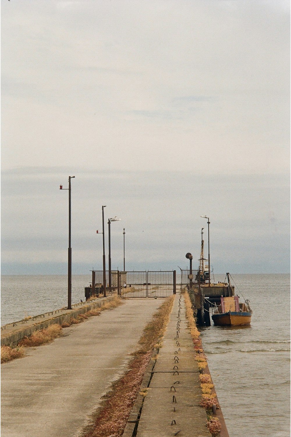 brown boat on sea shore during daytime