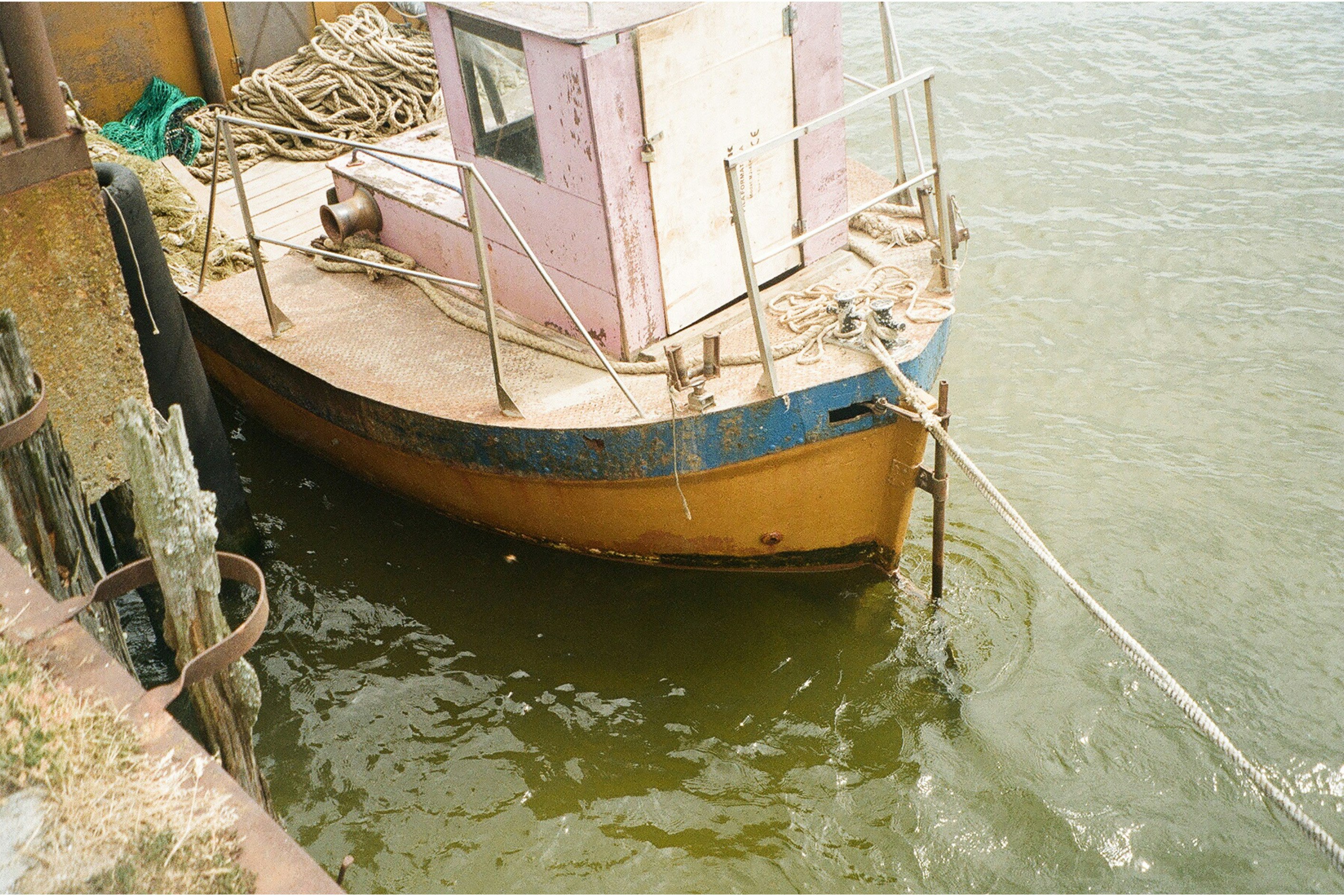 brown and white boat on water during daytime