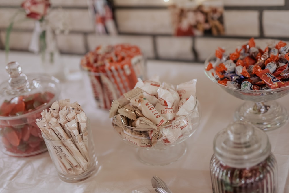 clear glass candy dish on white table