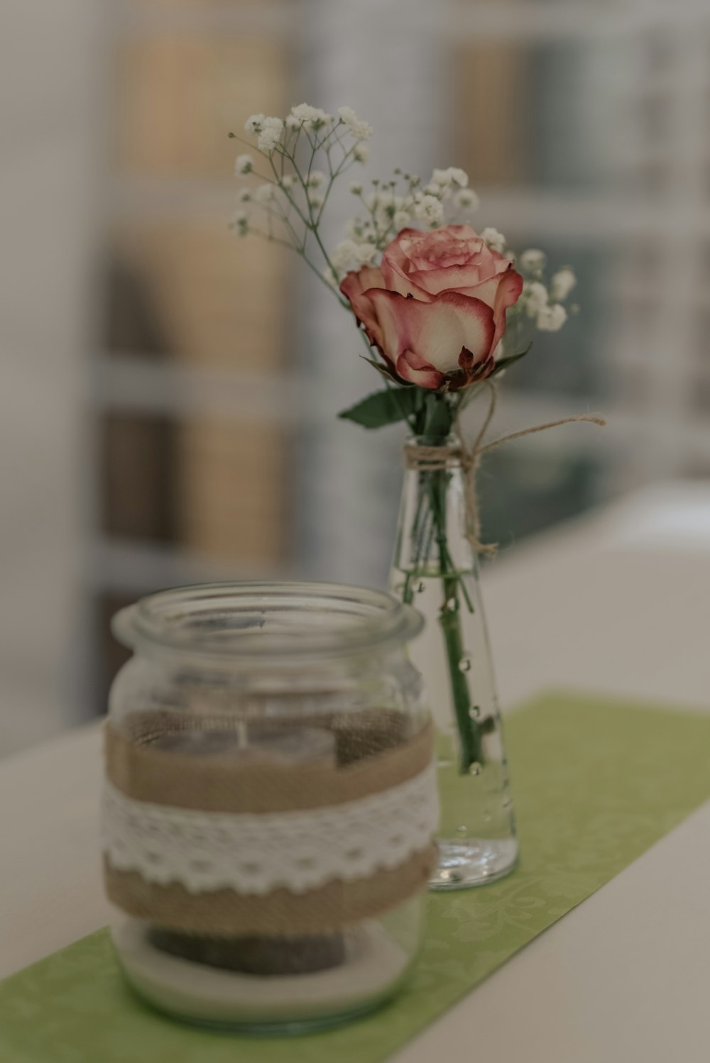 red roses in clear glass jar