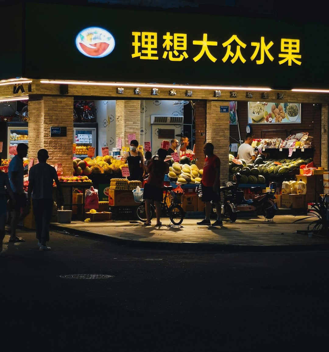 people standing in front of store during night time