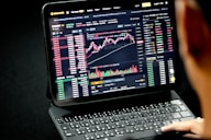 black laptop computer turned on displaying game application