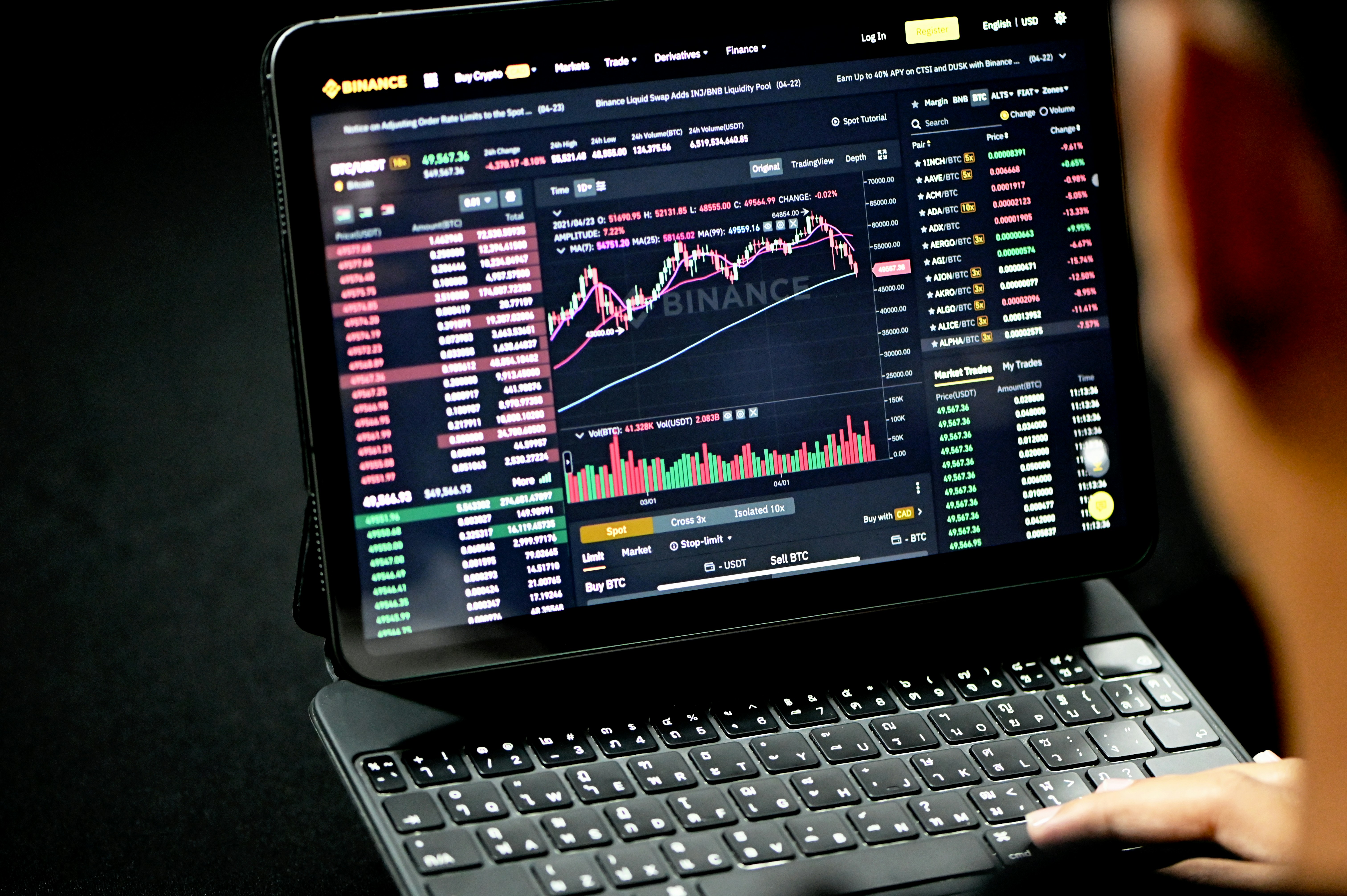 A man is looking at a trading site