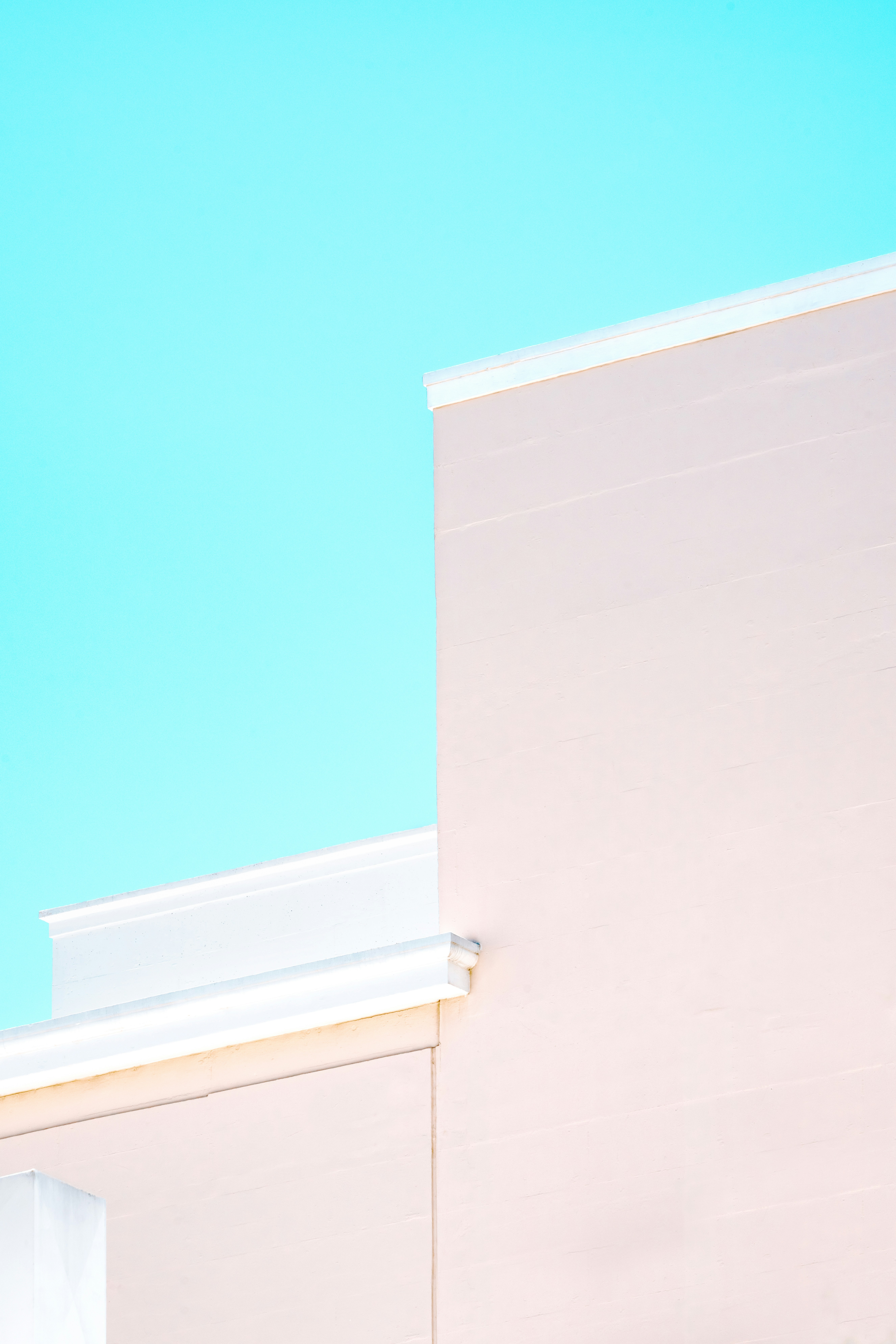 white concrete building under blue sky during daytime