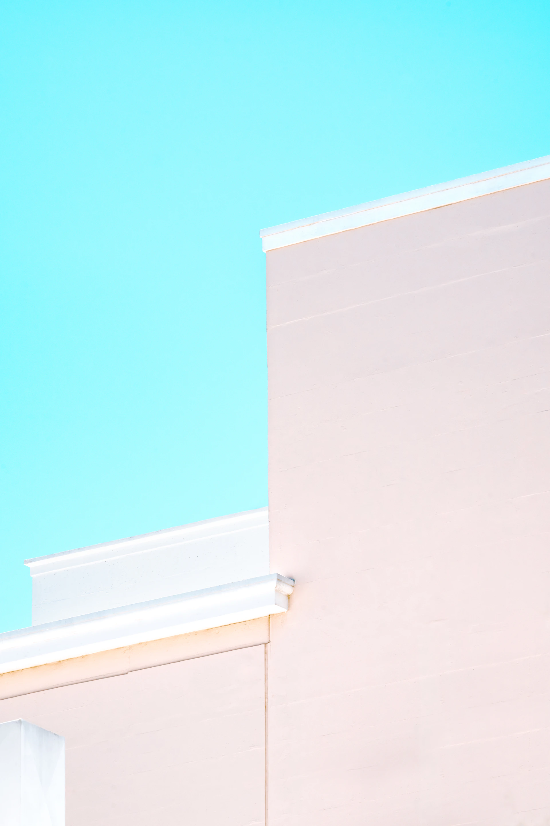 white concrete building under blue sky during daytime