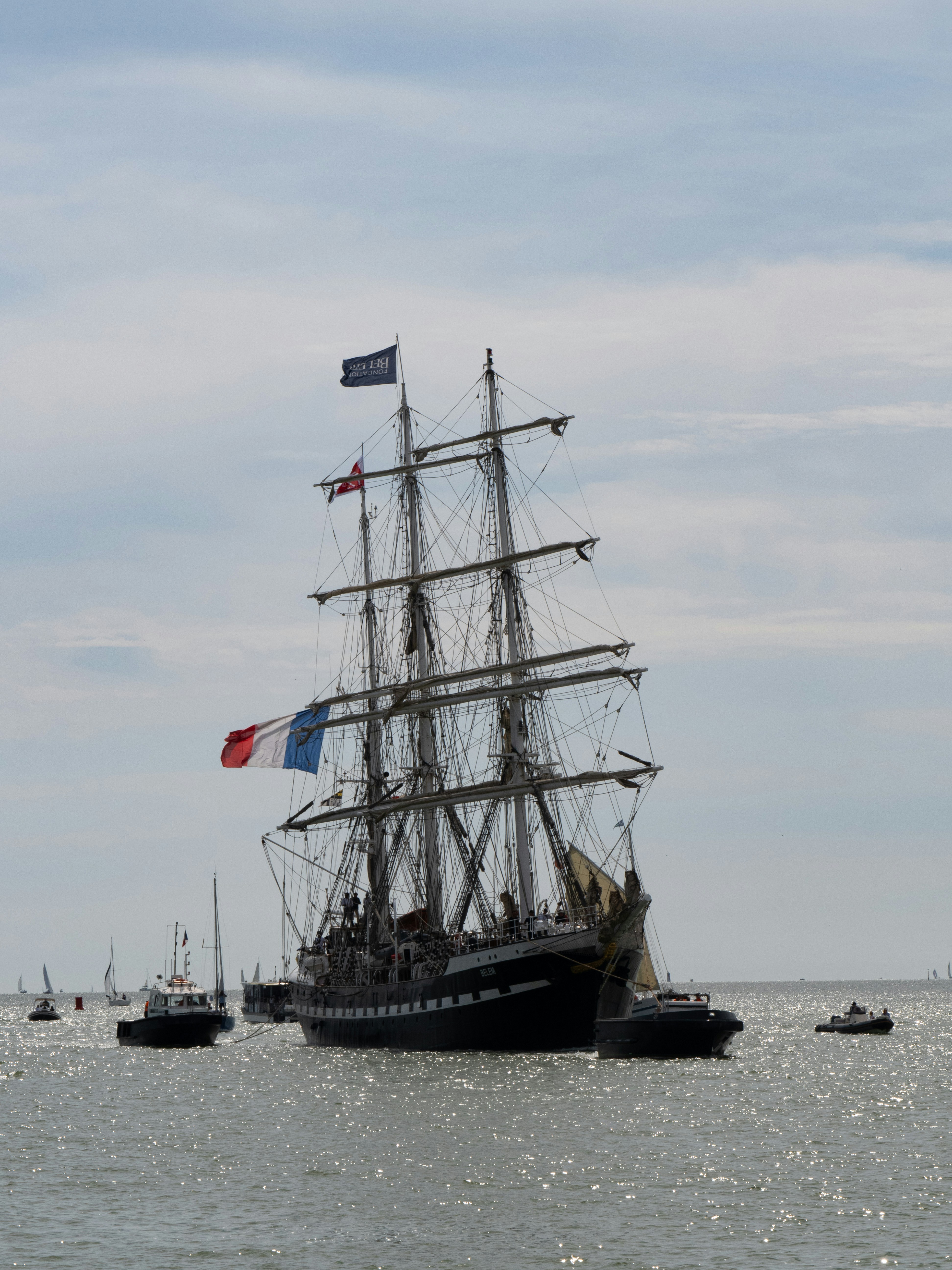 Black and white sail ship on sea during daytime photo Free La