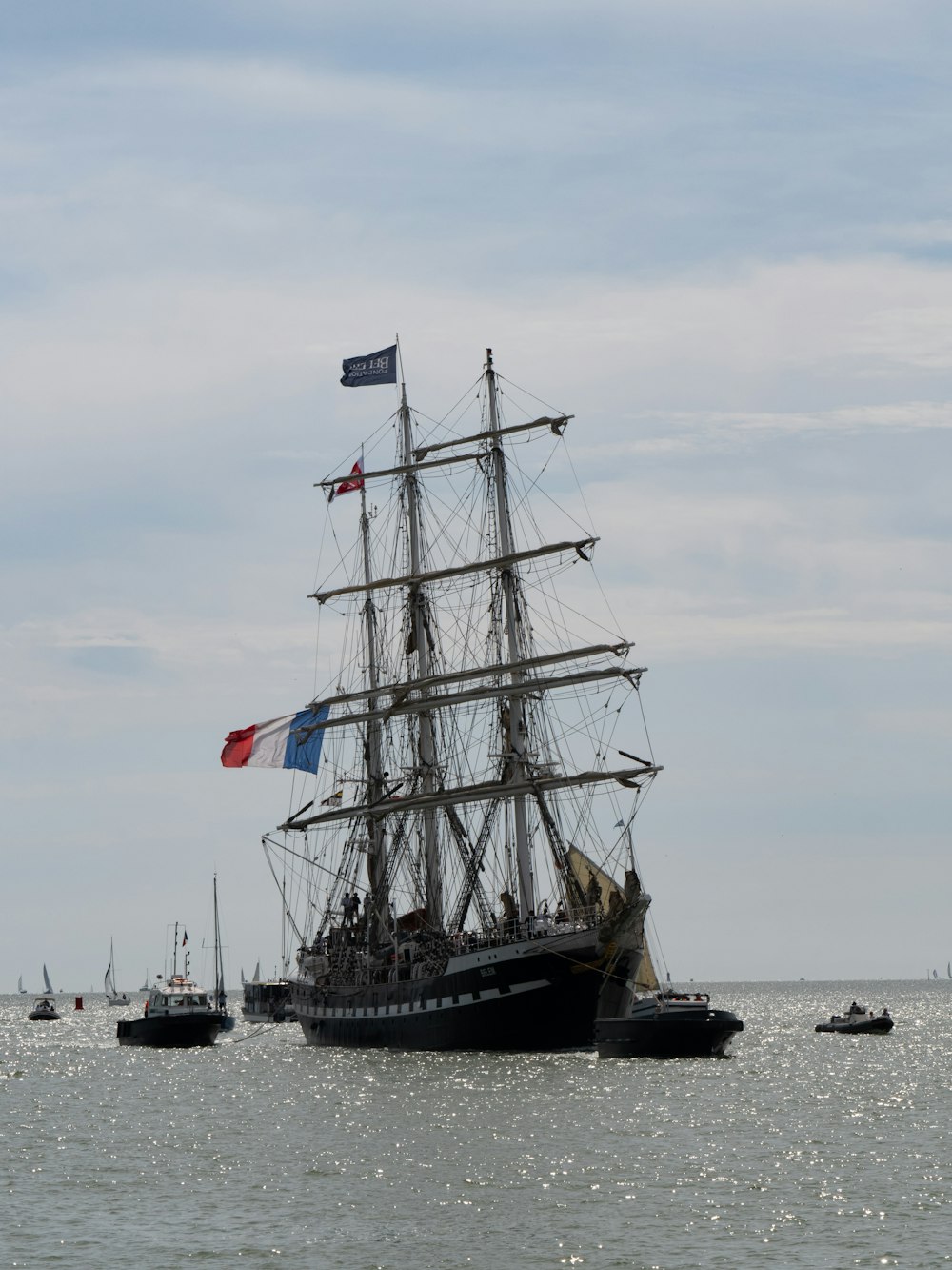 black and white sail ship on sea during daytime