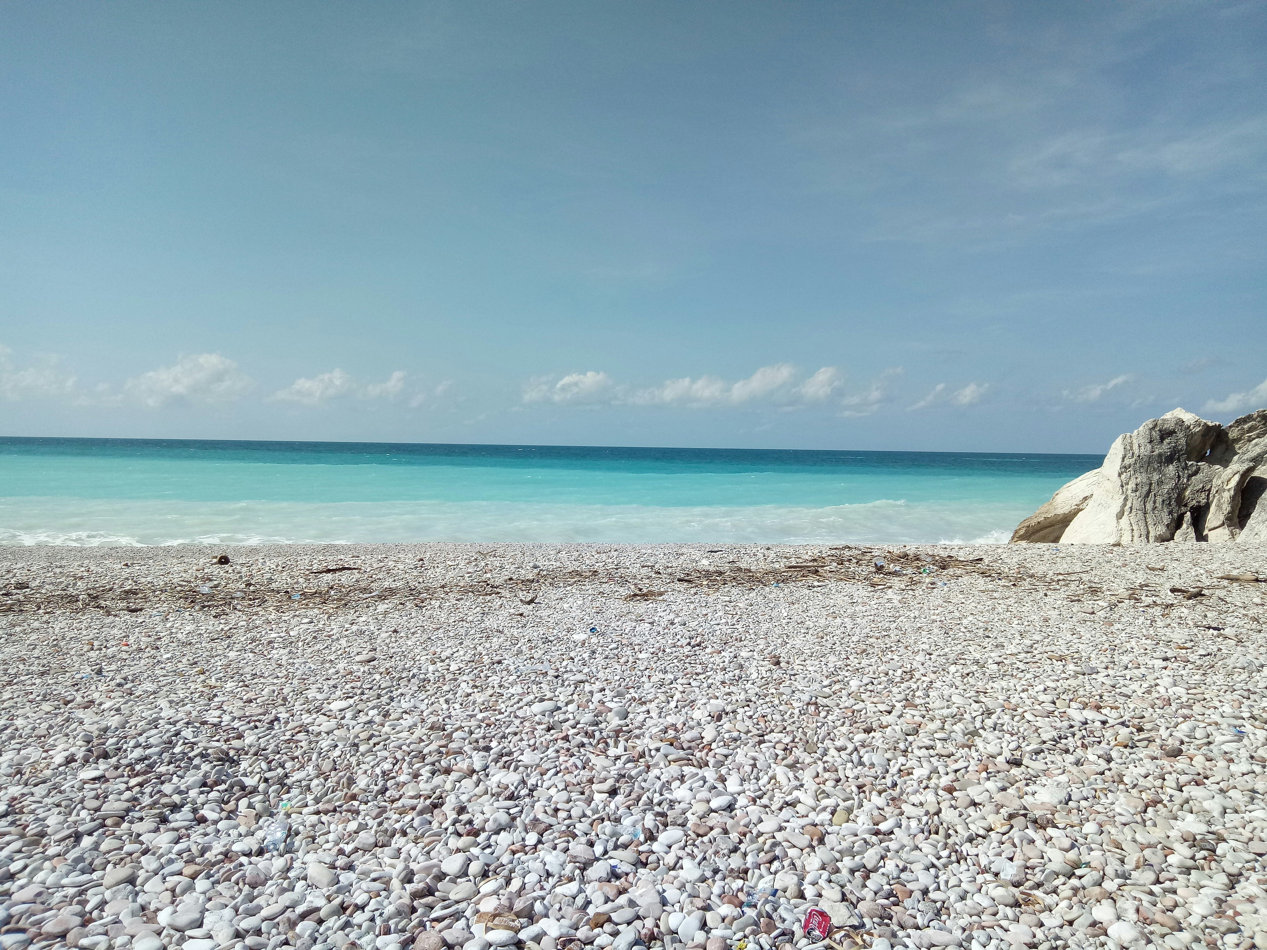 white sand beach during daytime