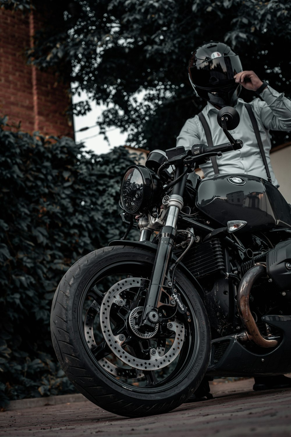 man in black jacket riding black motorcycle