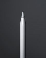 Elegant hand holding the Saycolor pen, with a soft golden light highlighting its sleek design.