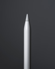 Close-up of a metal pen holder with a matte finish, catching natural light on a clean desk.