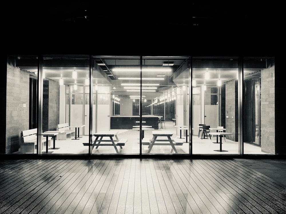 grayscale photo of glass doors