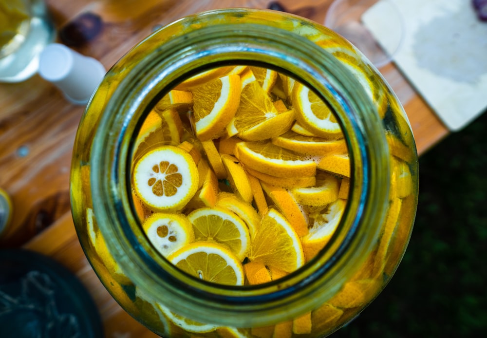 sliced lemon in clear glass jar