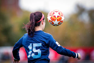 girl in blue and white nike soccer jersey shirt