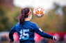 girl in blue and white nike soccer jersey shirt