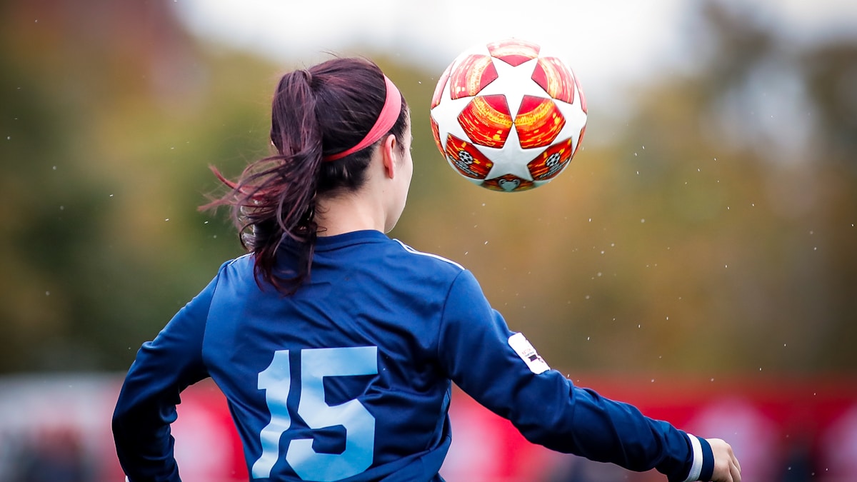 girl in blue and white nike soccer jersey shirt