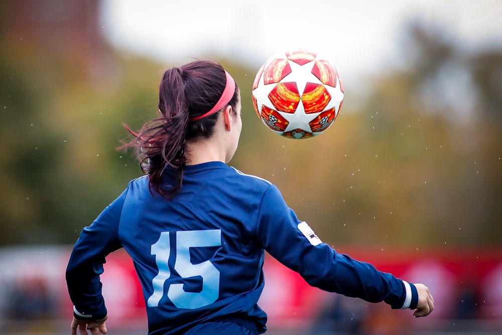 girl in blue and white nike soccer jersey shirt