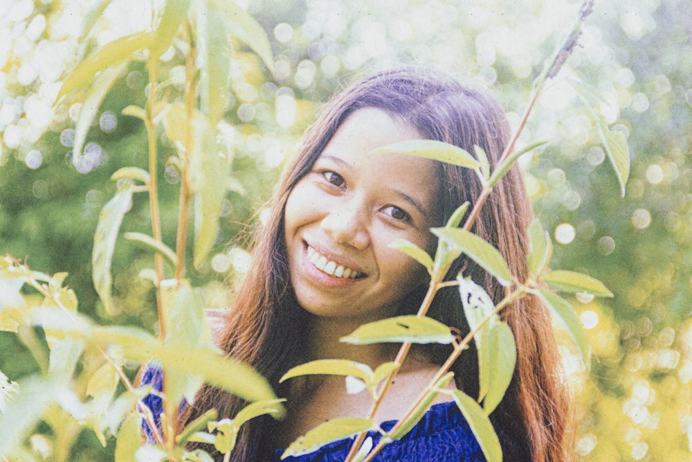 smiling woman in blue shirt