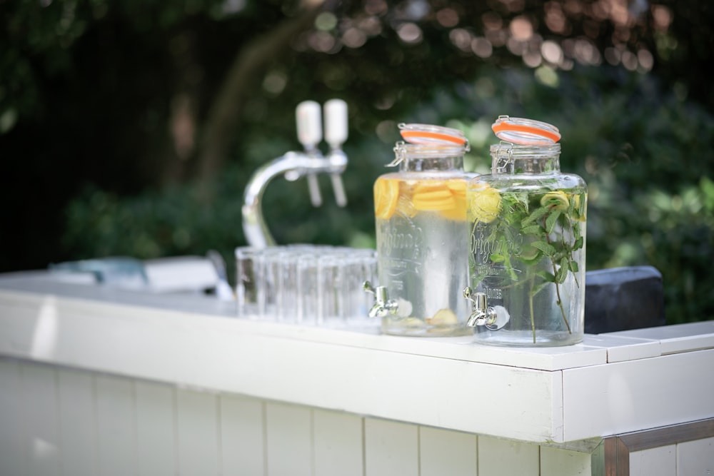 clear glass jars on white table