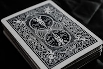 A close-up of colorful playing cards spread out on a table, showcasing unique designs and artwork.