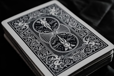 A close-up of colorful playing cards spread out on a table, showcasing unique designs and artwork.