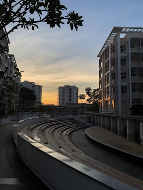 Outdoor garden area with amphitheater seating and people enjoying an evening event