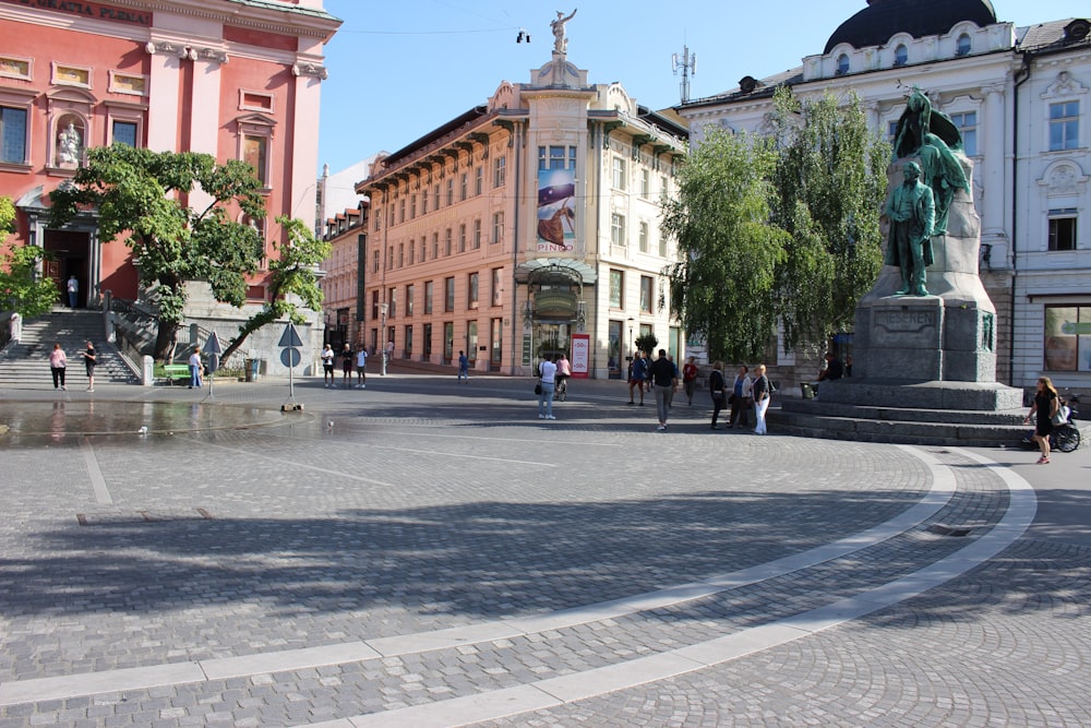 people walking on sidewalk near building during daytime