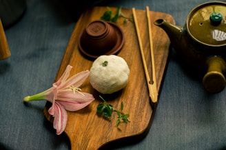 white garlic on brown wooden chopping board