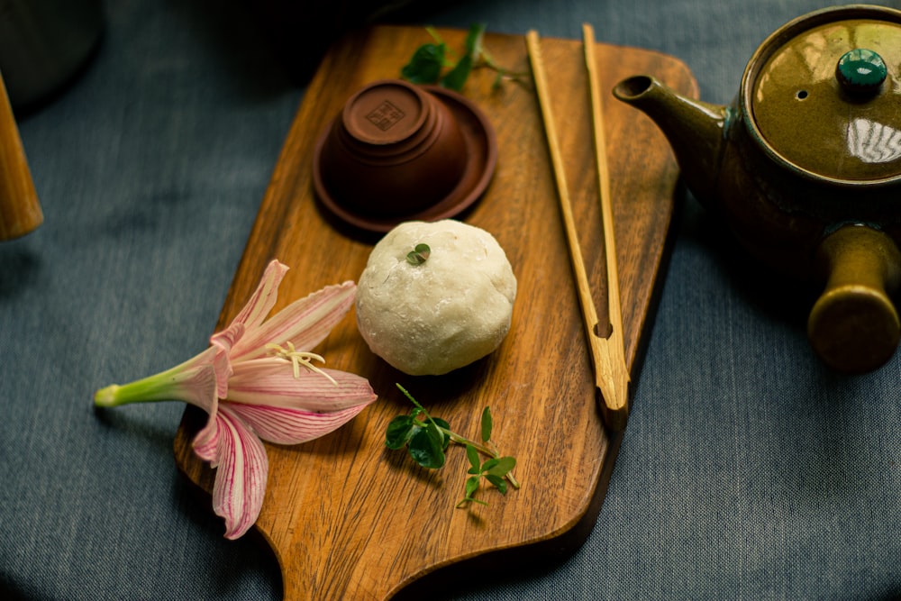 white garlic on brown wooden chopping board