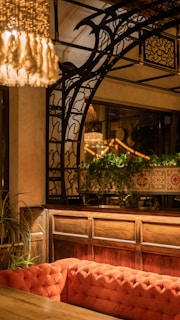 A cozy therapy space with warm lighting and soft teal and orange accents.