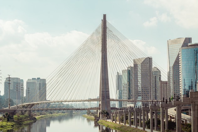 gray concrete bridge over river