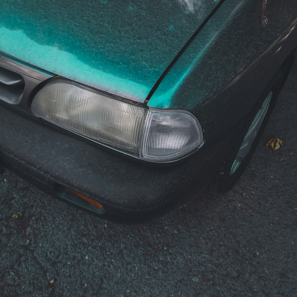 green car on gray concrete floor