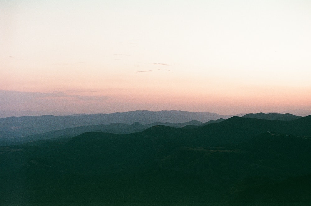 silhouette of mountains during sunset