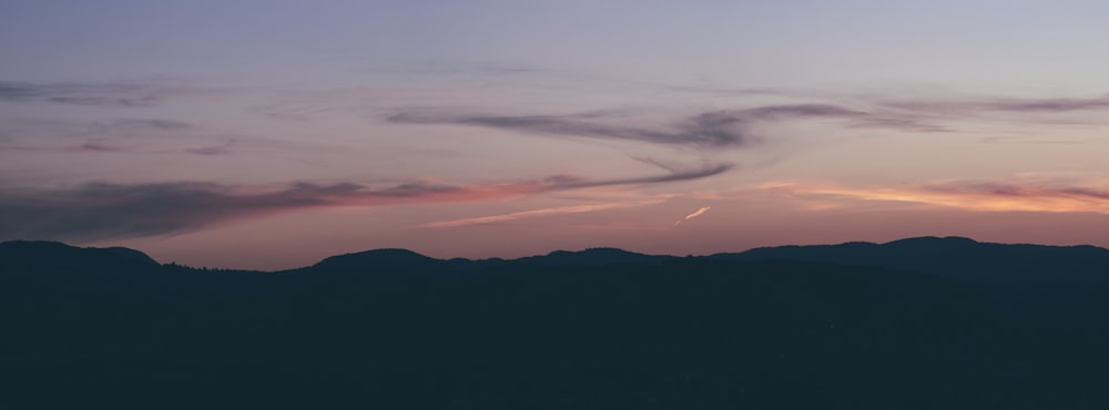 silhouette of mountain during sunset