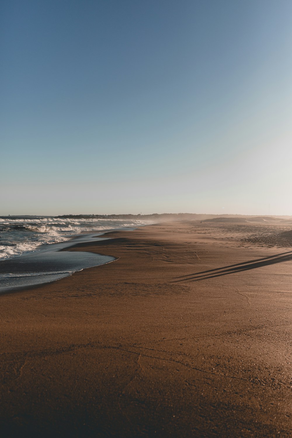 brown sand beach during daytime