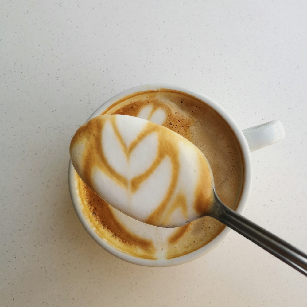 white ceramic mug with coffee