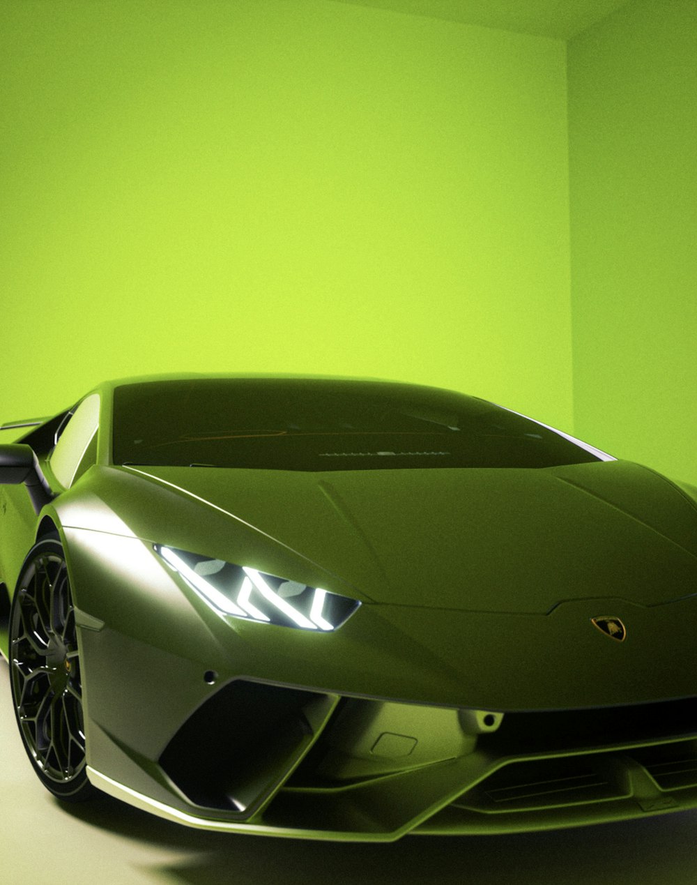 a green sports car in a green room