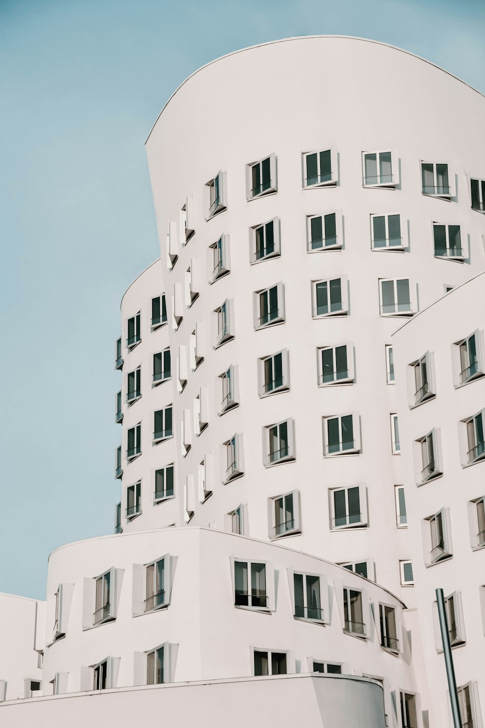 white concrete building under blue sky during daytime