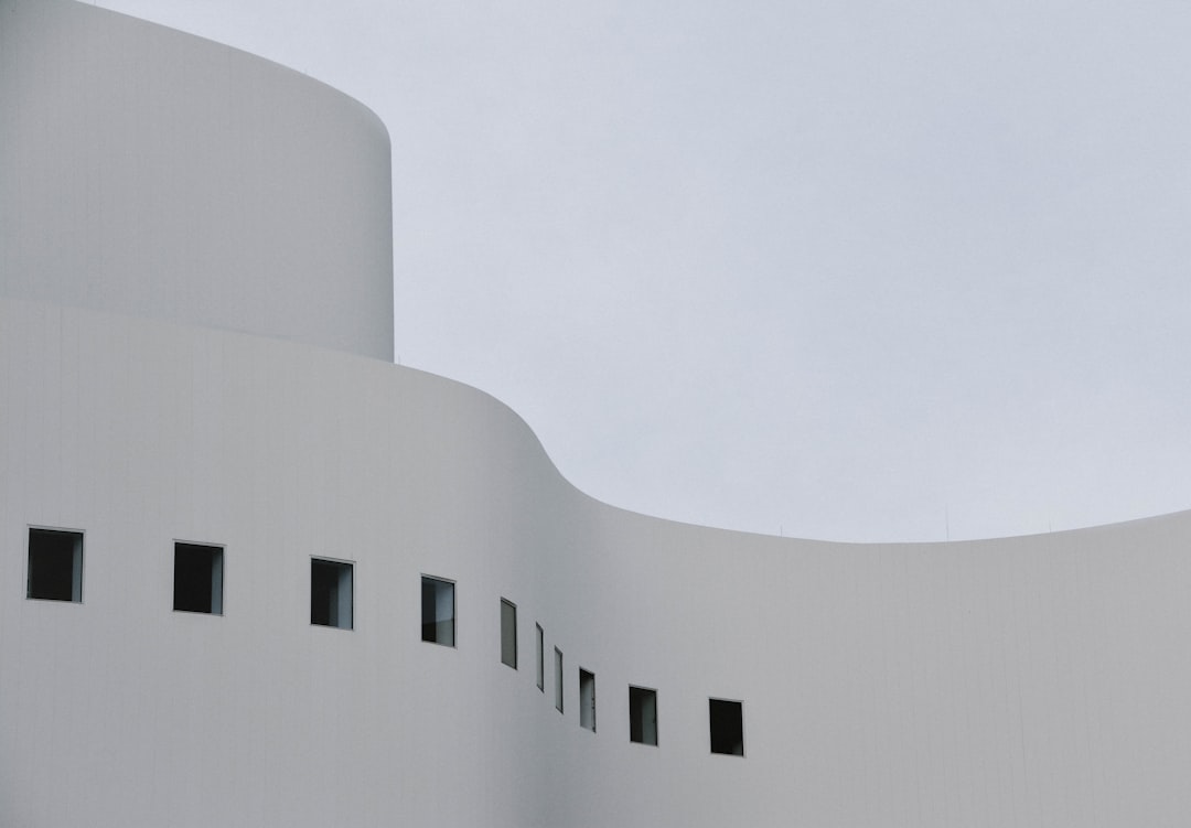 gray concrete building under white sky during daytime