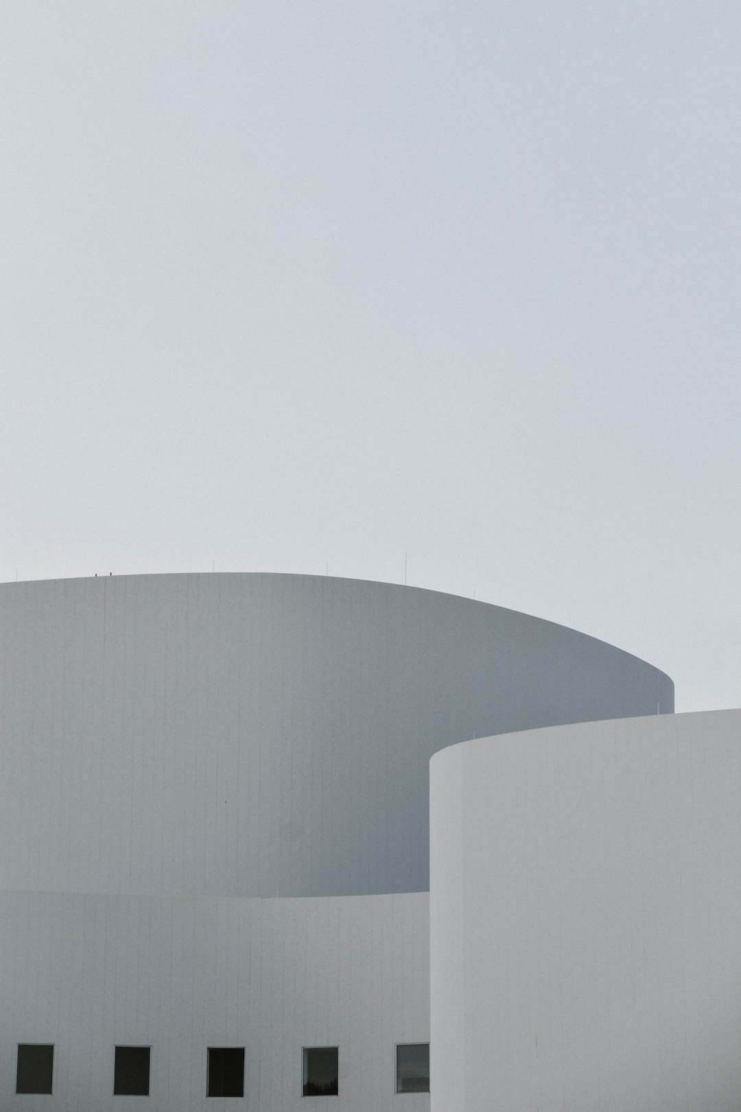 gray concrete building under white sky during daytime