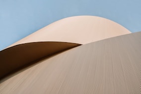 brown concrete building under blue sky during daytime