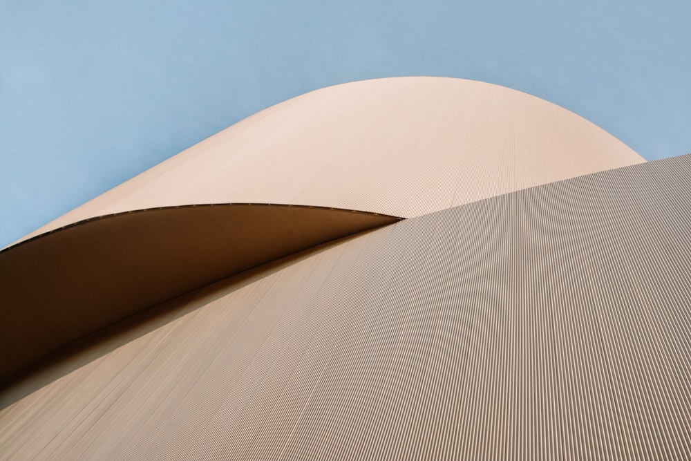 brown concrete building under blue sky during daytime