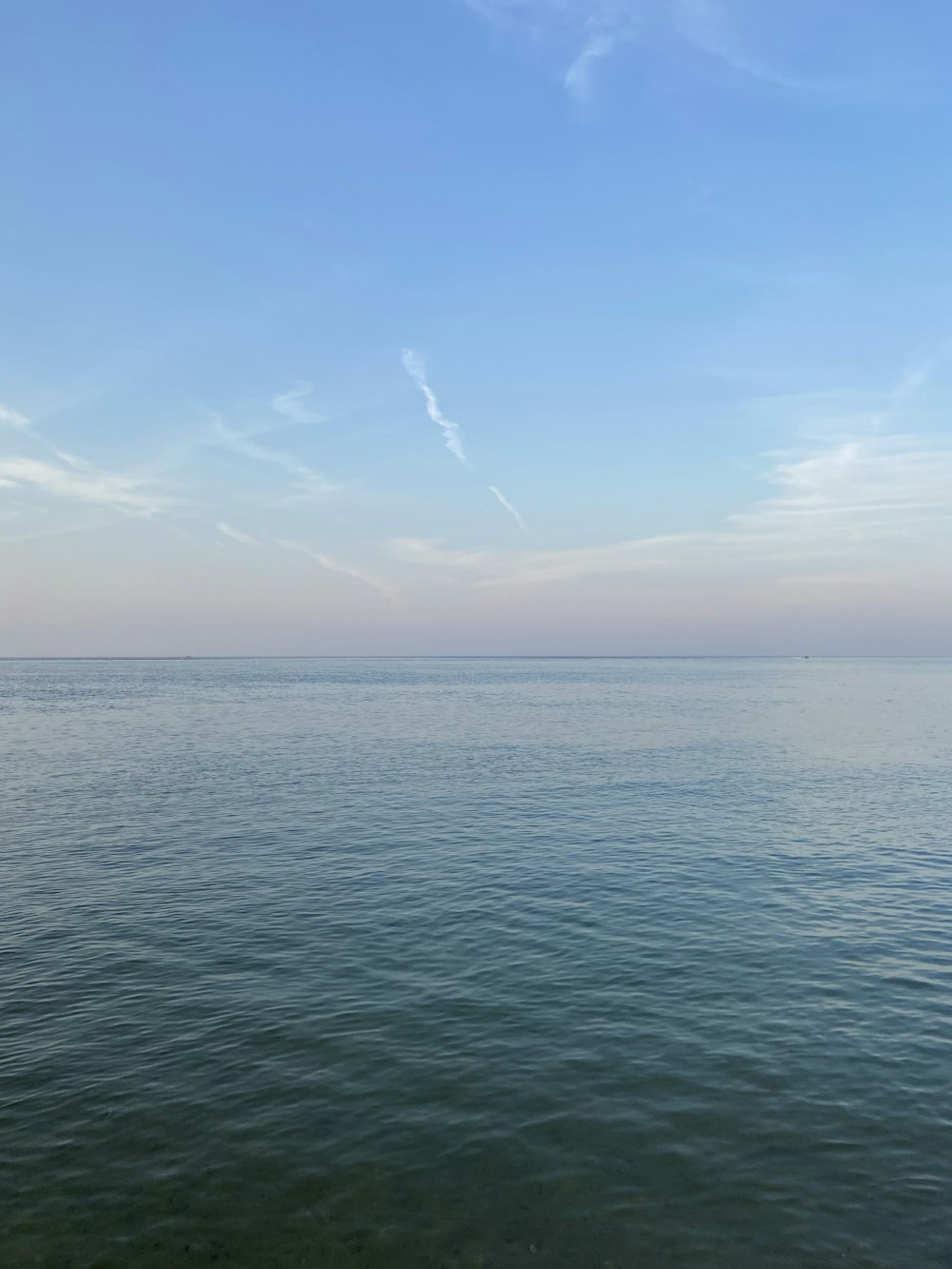 blue sea under blue sky during daytime