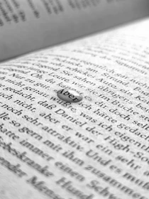 Close-up of a product card featuring a bestselling German grammar book with smooth hover animation and rating stars.