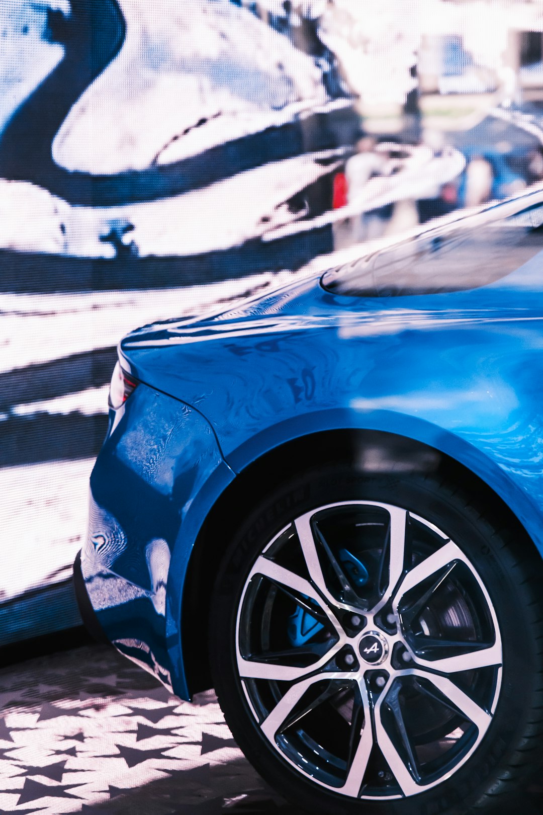 blue car with silver wheel