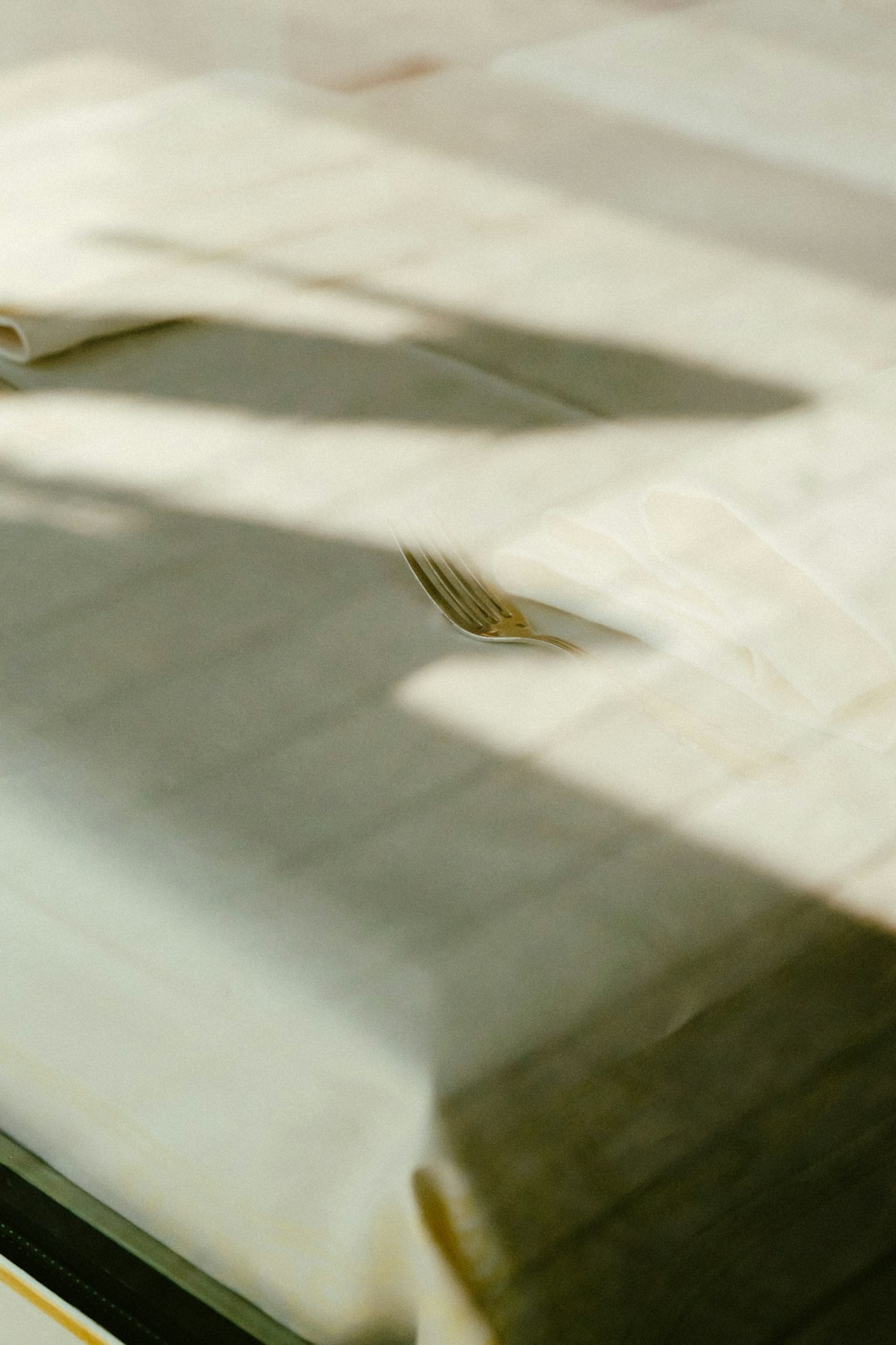 brown and black bird on white textile