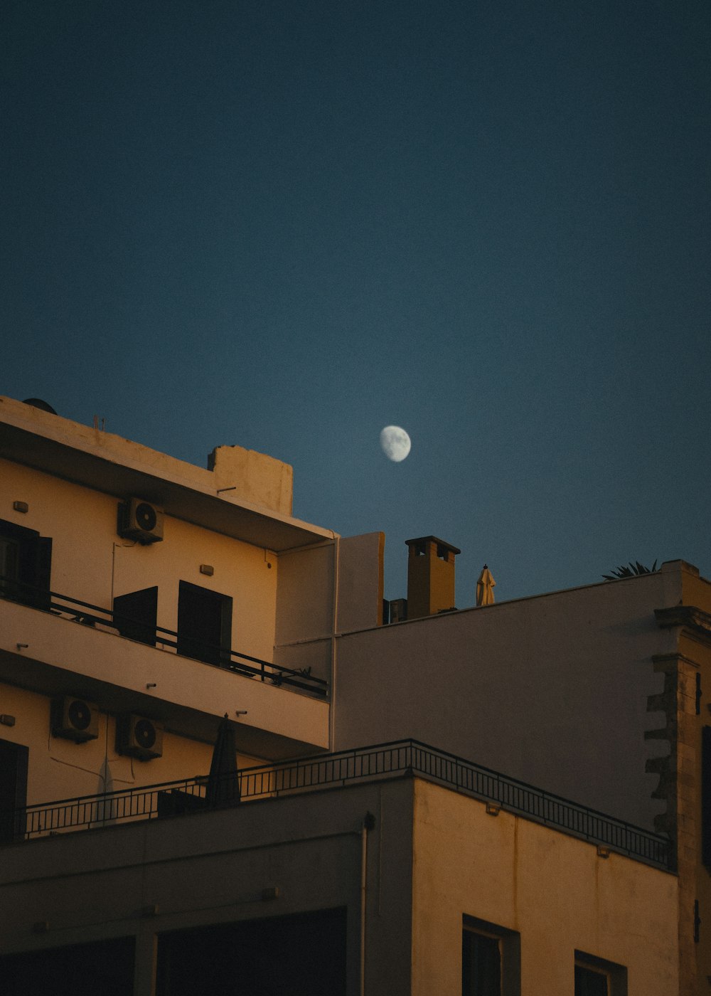 white concrete building under blue sky during night time