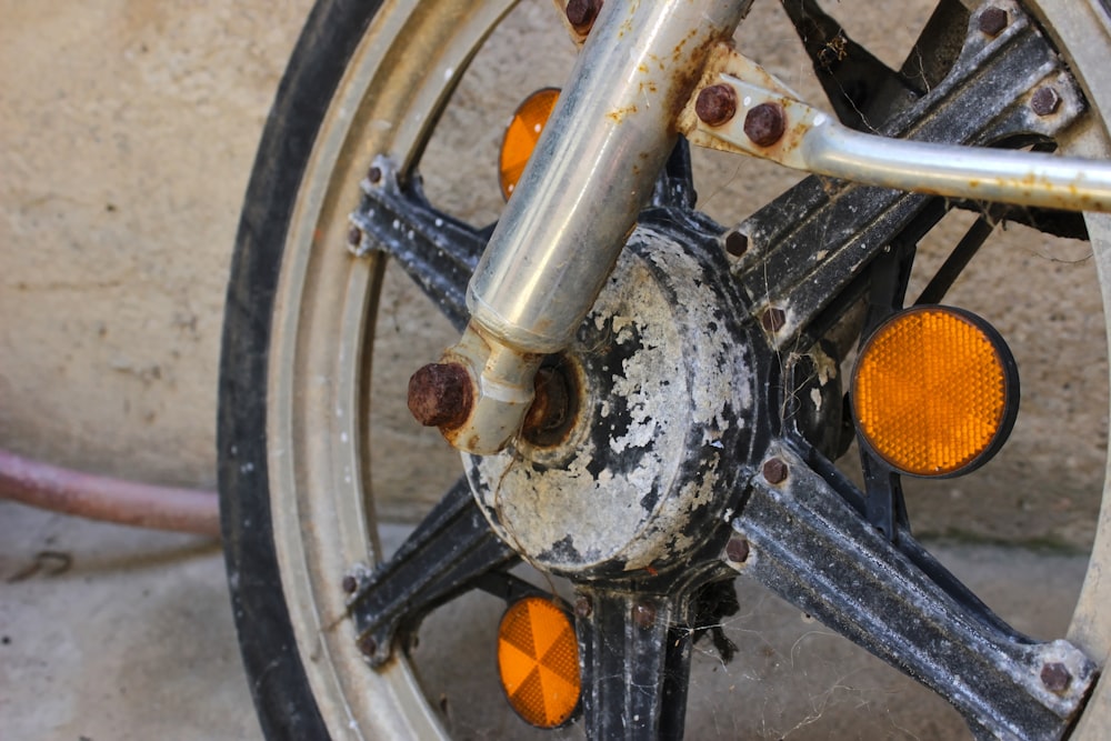 black motorcycle wheel with orange round plastic