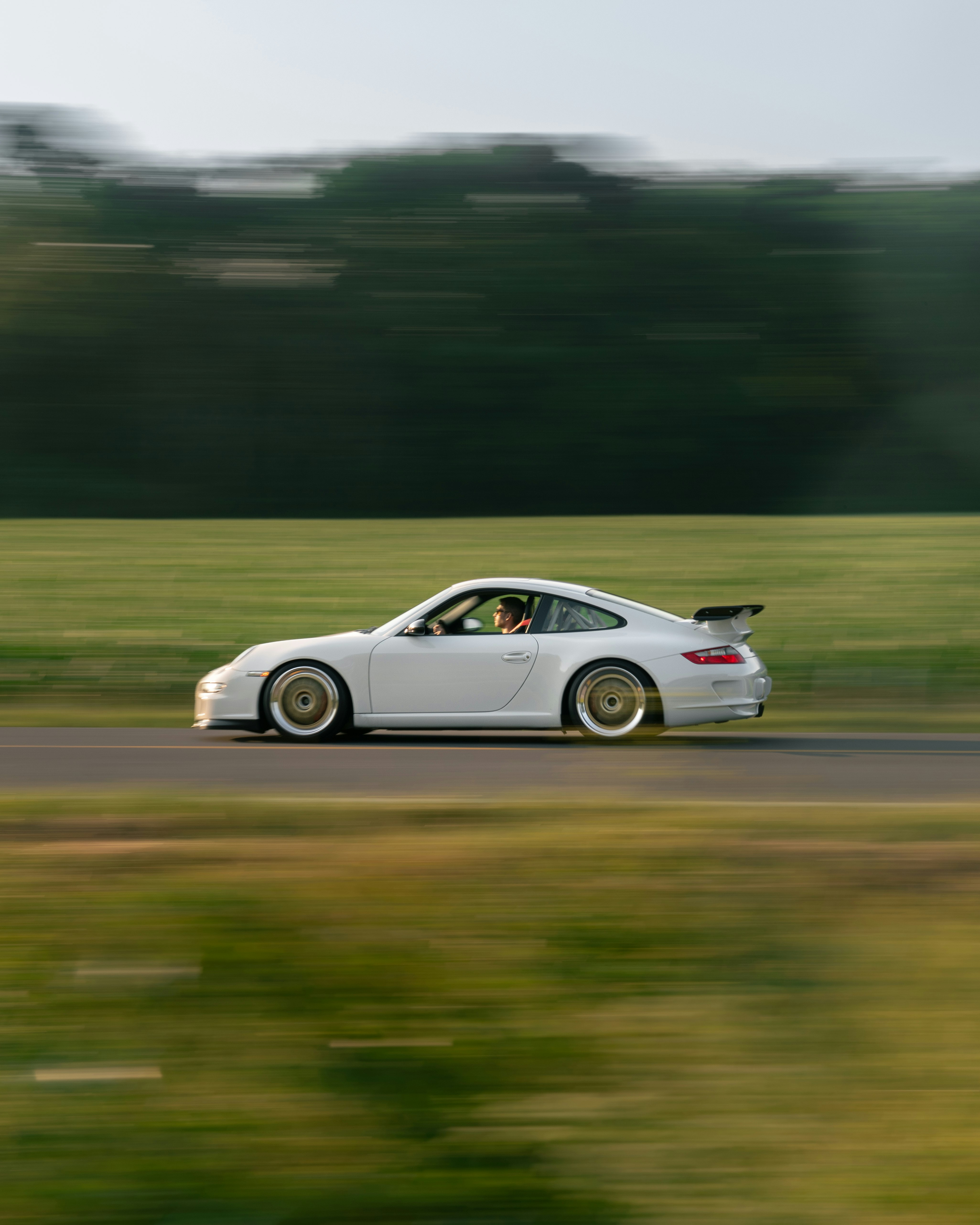 white porsche 911 on road during daytime