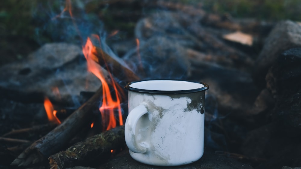 white ceramic mug with fire